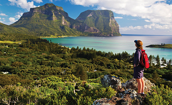 Hiker walking along the coast in Australia/
