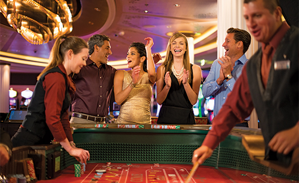 Passengers enjoying a night in the casino on a Celebrity Cruises ship/