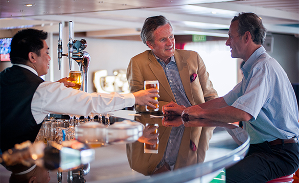 Two gentlemen enjoying a pint in the Lido lounge on Fred Olsen cruise ship Boudicca/