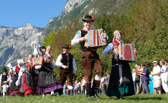 Slovenian people in traditional dress parading at the Cow Ball in Bohinj, Slovenia/