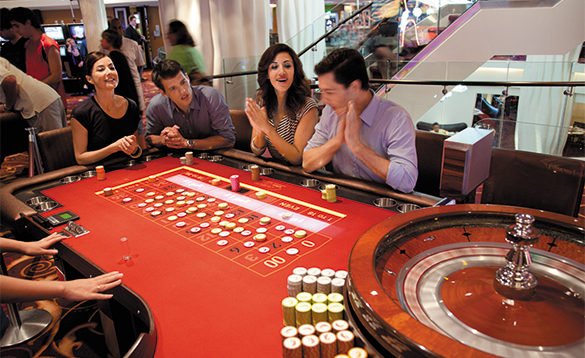 Passengers playing roulette in the casino onboard a NCL cruise ship/