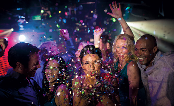 Group of friends partying in a disco onboard a NCL cruise ship/