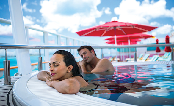 Couple relaxing in a jacuzzi onboard a NCL cruise ship/