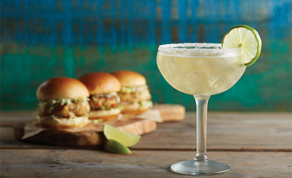 Three burgers and a cocktail served onboard a NCL cruise ship/