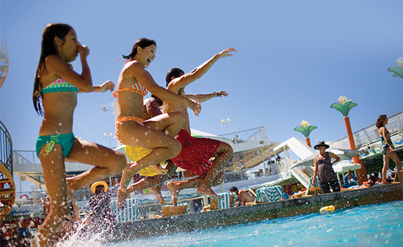 Group of children jumping into the pool onboard a NCL cruise ship/